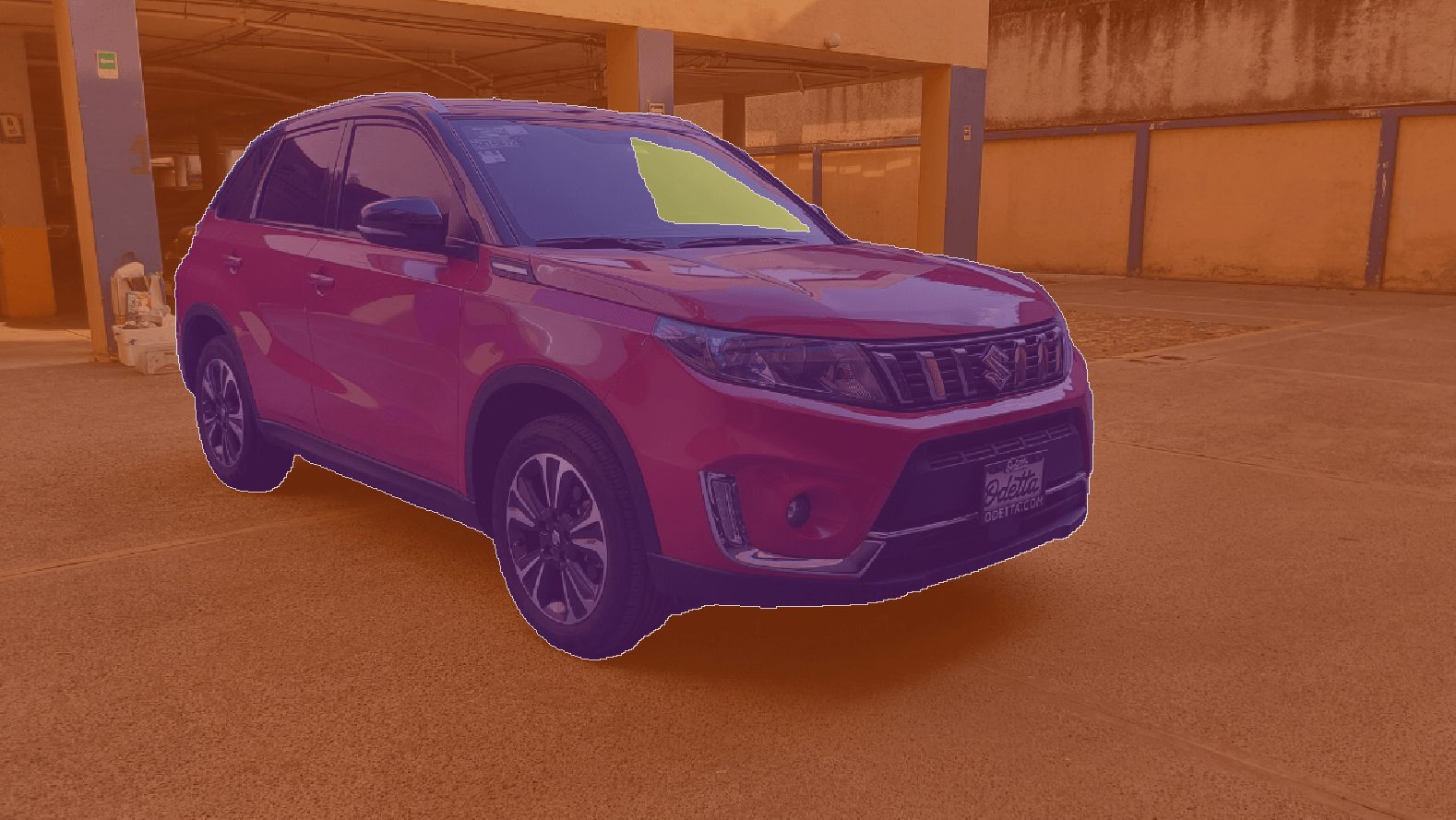 A red SUV parked in an empty outdoor lot, with a yellowish tint to the background, captured the scene reminiscent of data points from SemanticKITTI.