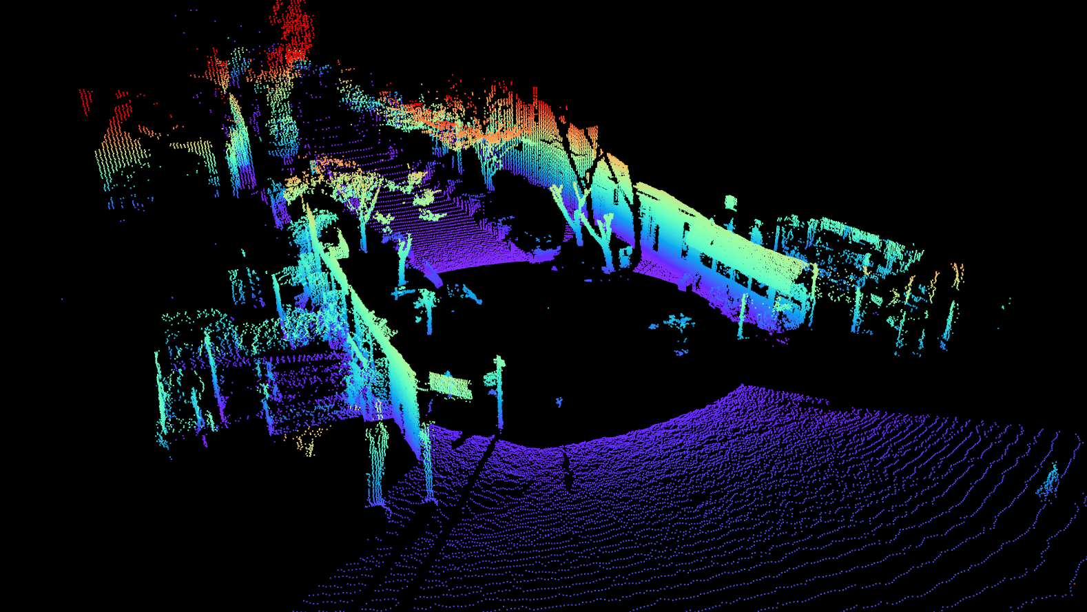 Colorful 3D point cloud map demo showcasing various structures and trees, overlaid with a neon-like, rainbow color gradient captured by the Ouster OS 2.