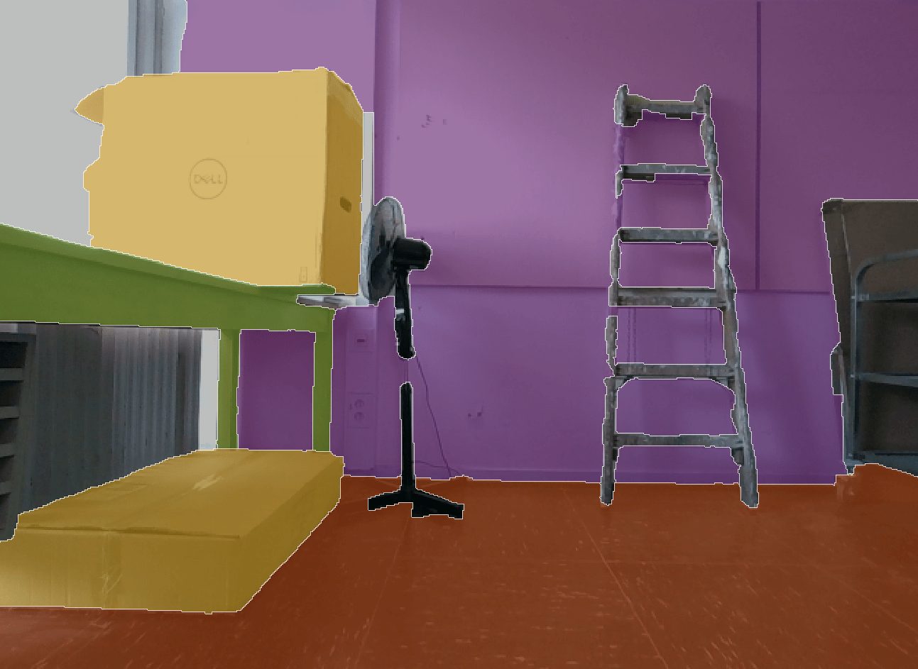 Room with a table, boxes, standing fan, and ladder against a purple wall. The floor is brown, the table and boxes are yellow, and the walls look like they've seen more street repair than decor.